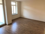 Referenzbild Wohnzimmer - **HELLE BARRIEREFREIE 1,5-RWG *** EINBAUKÜCHE – FUßBODENHEIZUNG – BALKON- AUFZUG **WE 02**